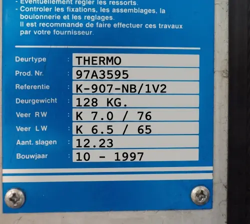 Novoferm industrial torsion spring data plate
            2